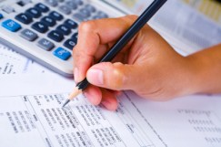 Hand checking financial report